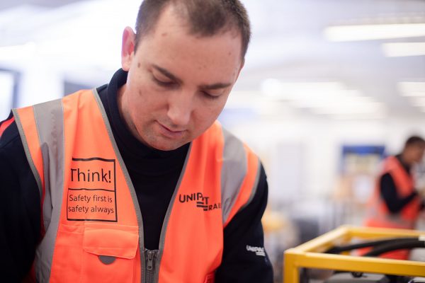 Unipart colleague wearing safety first jacket